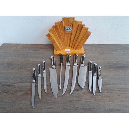 698 - A set of Runtik Imperial kitchen knives and sharpener