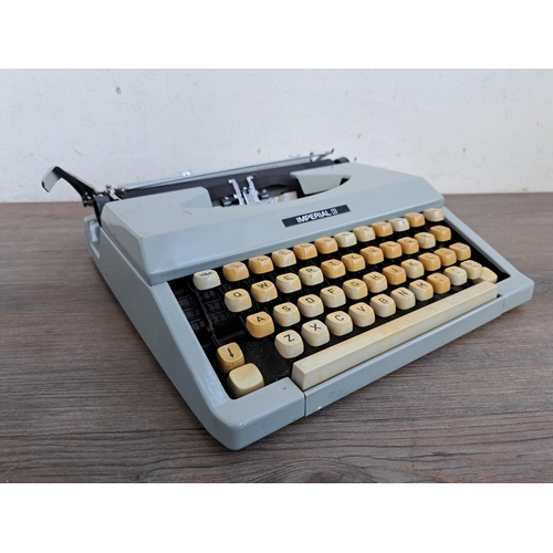 701 - An Imperial Signet portable typewriter