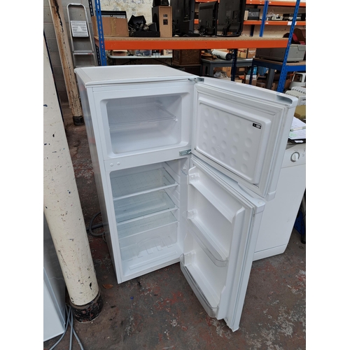 709 - An unbranded freestanding fridge freezer - approx. 114cm high x 47cm wide x 49cm deep