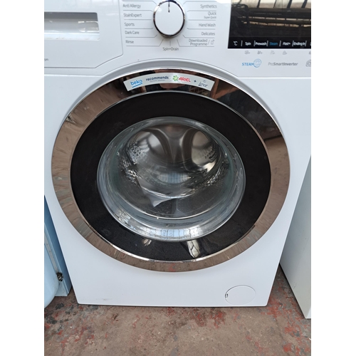 717 - A Beko undercounter washing machine - approx. 84cm high x 59cm wide x 57cm deep