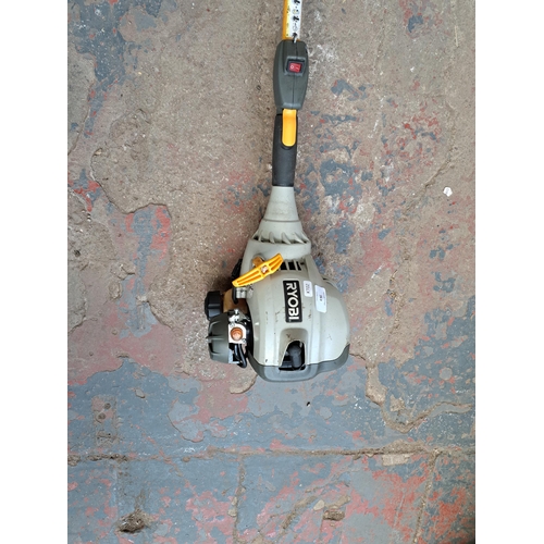 763 - A Ryobi petrol long reach multi tool with chainsaw attachment