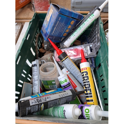 780 - Two boxes containing a large collection of Olive silicone, Everbuild roof and gutter sealant, varnis... 