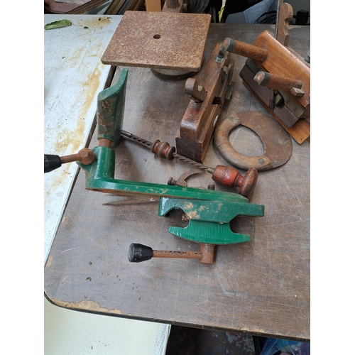 786 - A collection of antique tools to include cast iron drill press, two wood planes etc.