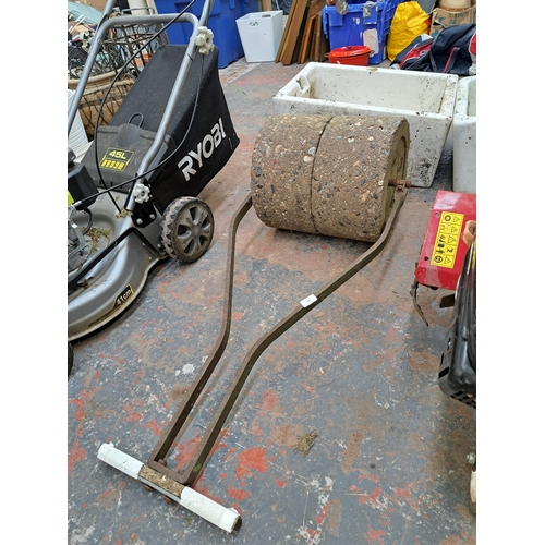 794 - A cast iron and concrete garden roller