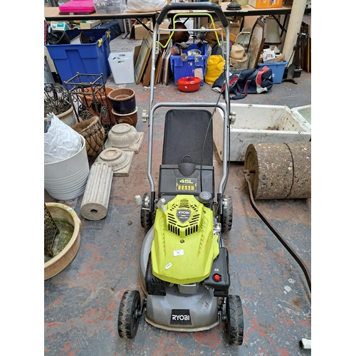 795 - A Ryobi RLM4114 petrol lawn mower with grass collector