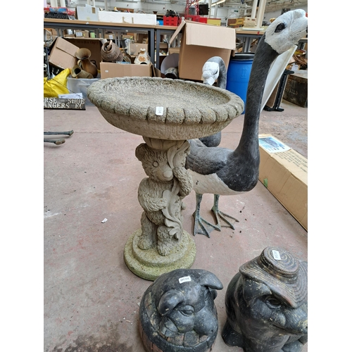 806 - A collection of garden items, pair of painted metal swan figurines, cast stone pedestal bird bath in... 