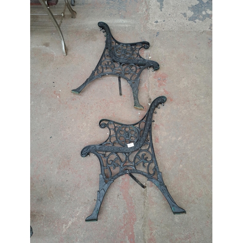 808 - A pair of 19th century style cast iron garden bench ends