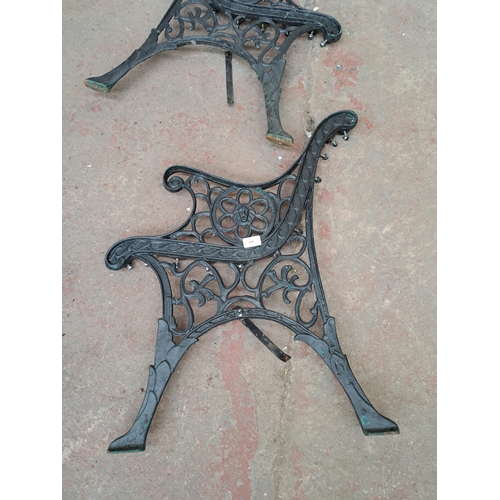 808 - A pair of 19th century style cast iron garden bench ends