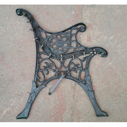 808 - A pair of 19th century style cast iron garden bench ends