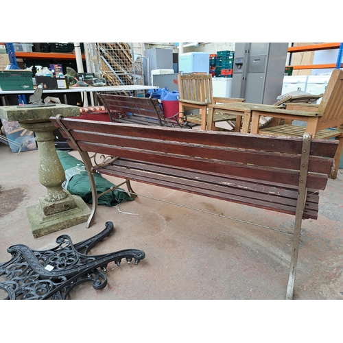 810 - A cast iron and wooden slatted garden bench