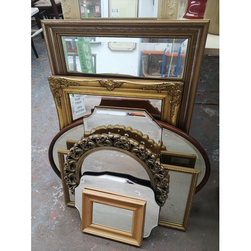 868 - A collection of framed mirrors