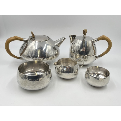 2300 - A Philip Lowery (Son-in-law and pupil of Dunstan Pruden) hallmarked London silver five piece tea set... 