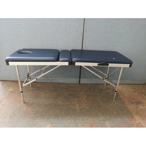 744 - A folding massage table