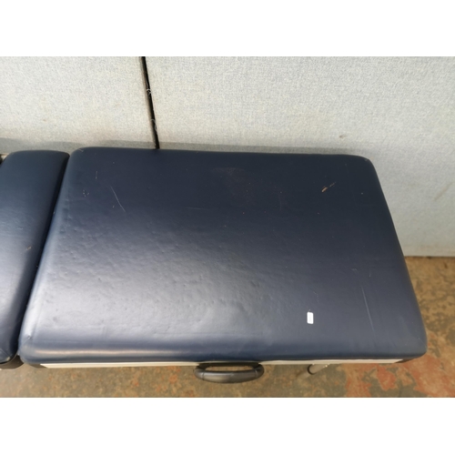 744 - A folding massage table