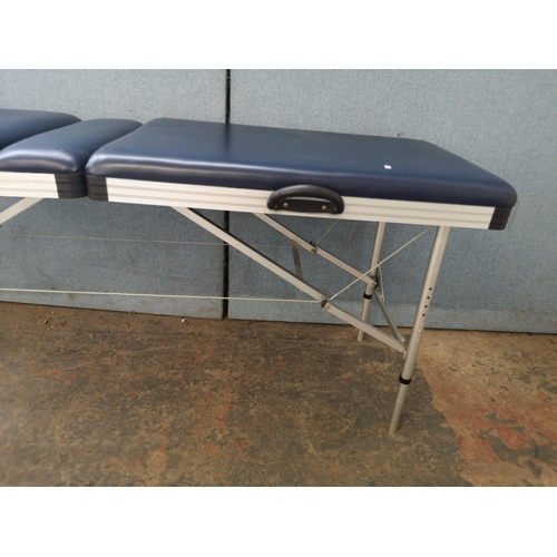 744 - A folding massage table