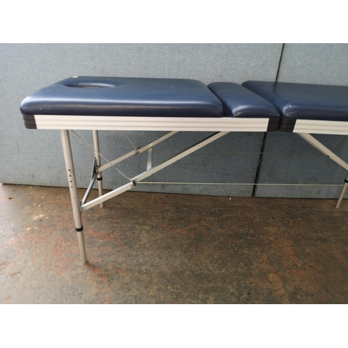 744 - A folding massage table