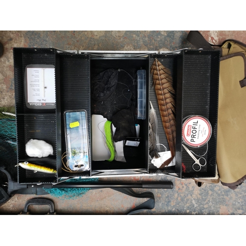 745 - A collection of fishing tackle to include three Daiwa carbon fibre and cork handled fly rods, three ... 