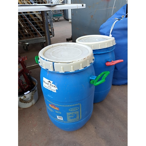 818 - Four plastic water barrels