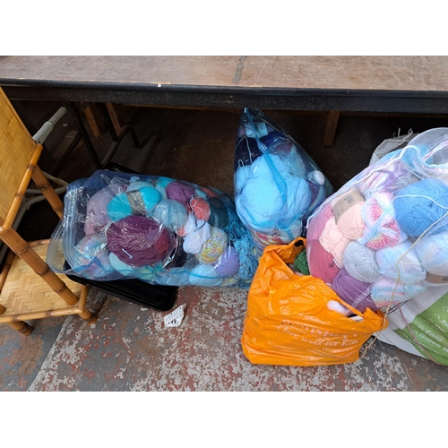 821 - Nine bags containing a large collection of knitting yarn