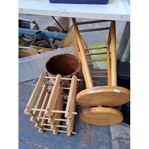 843 - A collection of house clearance items to include wickerware, pair of beach bar stools, six section M... 