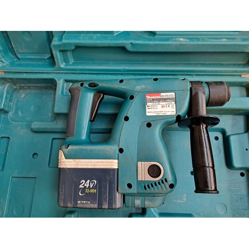 777 - Two cased hammer drills, one Makita cordless and one Performance 240v