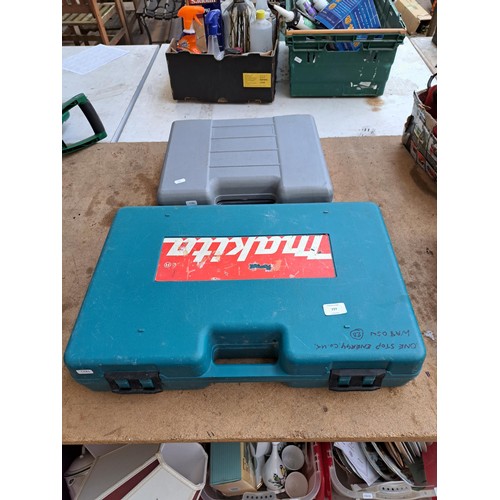 777 - Two cased hammer drills, one Makita cordless and one Performance 240v