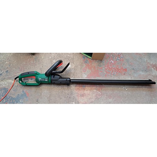 778 - Two Qualcast 240v garden tools, one boxed hedge trimmer and one strimmer