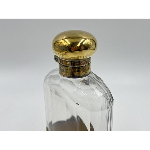 2304 - A hallmarked London silver and glass hip flask with hallmarked London silver removable cup, dated 19... 