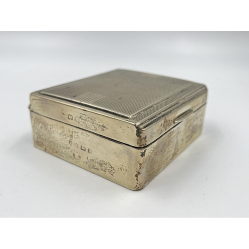 2304A - An Art Deco hallmarked Birmingham silver cigarette box with wooden lining, dated 1938 - approx. gros... 