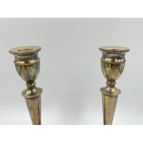 2312 - A pair of A T Cannon Ltd hallmarked Birmingham silver weighted candlesticks, dated 1973 - approx. gr... 