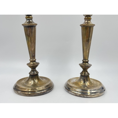 2312 - A pair of A T Cannon Ltd hallmarked Birmingham silver weighted candlesticks, dated 1973 - approx. gr... 