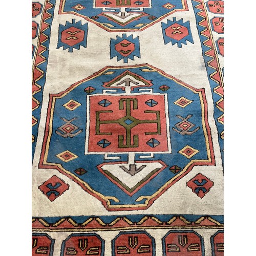 89 - A hand knotted Kazak rug - approx. 230cm x 150cm