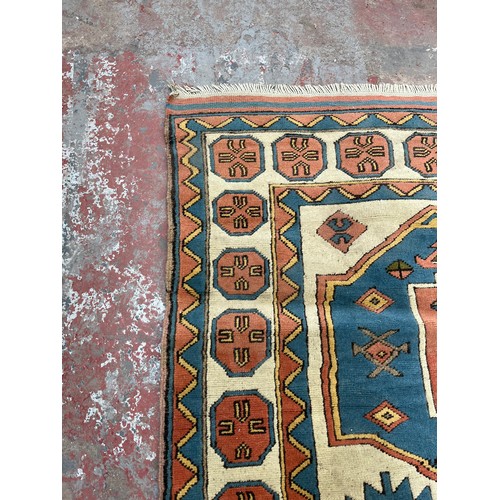 89 - A hand knotted Kazak rug - approx. 230cm x 150cm