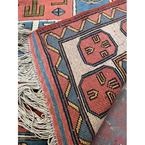 89 - A hand knotted Kazak rug - approx. 230cm x 150cm