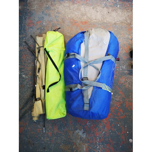 748A - Three pieces of camping equipment, one bagged Iowa three room tunnel tent and two camping beds