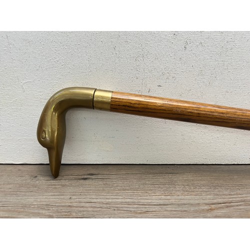 433B - A mid 20th century oak and brass novelty duck walking stick