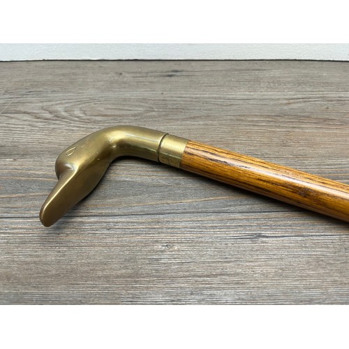 433B - A mid 20th century oak and brass novelty duck walking stick