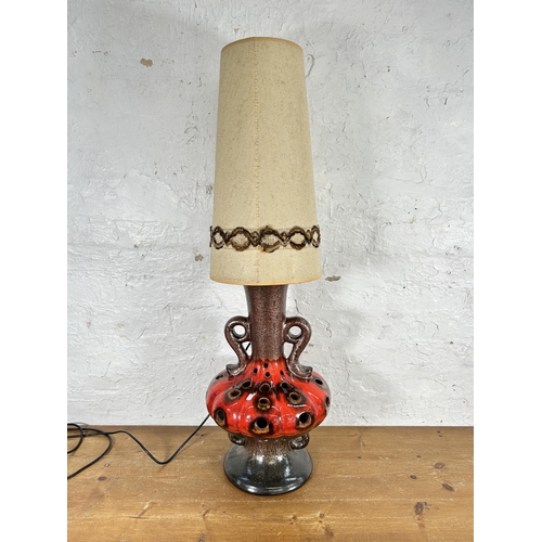 402A - A mid 20th century West German fat lava pottery lamp with shade - approx. 100cm high