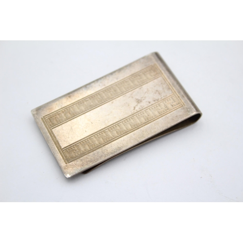 2261 - A William Manton hallmarked Birmingham silver money clip, dated 1982 - approx. gross weight 21g