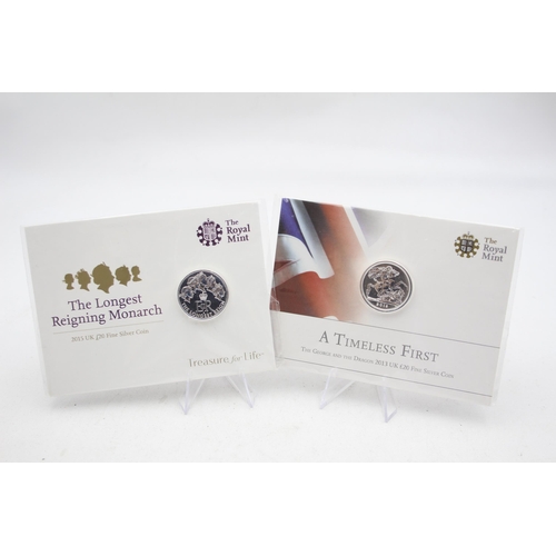 2288 - Two The Royal Mint £20 fine silver coins, one A Timeless First The George and The Dragon 2013 and on... 