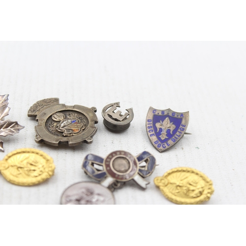 2292 - Nine hallmarked .925 silver pin badges - approx. gross weight 56g