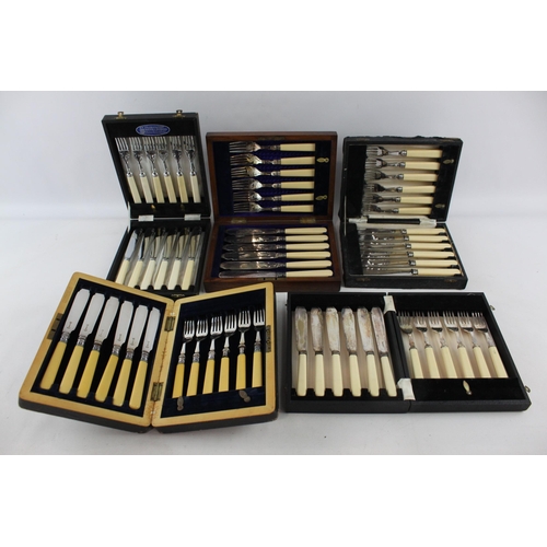 390 - Five boxed silver plated and ivorine fish cutlery sets