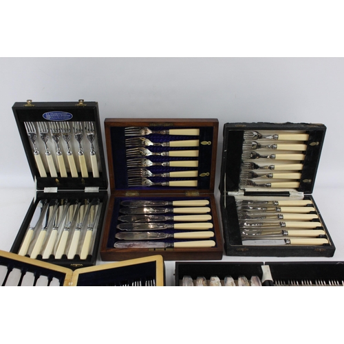 390 - Five boxed silver plated and ivorine fish cutlery sets