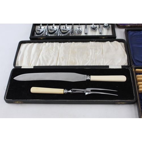 390A - Four boxed silver plated and ivorine cutlery sets