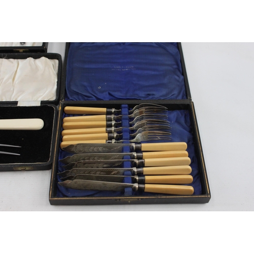 390A - Four boxed silver plated and ivorine cutlery sets