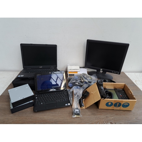 673 - A collection of computer related items to include Dell Inspiron Mini laptop, Acer TravelMate 5330 et... 