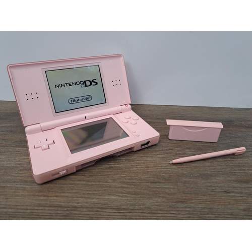 677 - A Nintendo DS Lite with Dr. Kawashima's Brain Training game