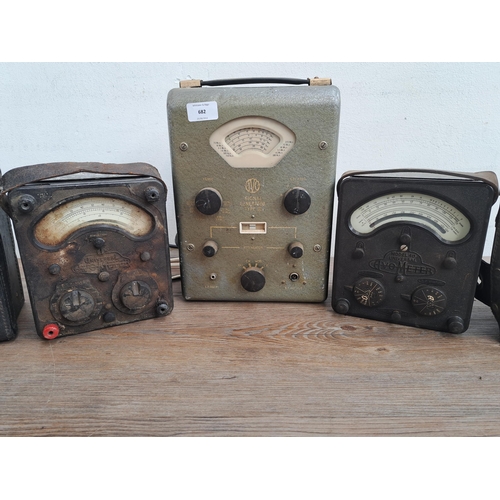 682 - Three AVO meters together with two  military issue cases, one Mk II and one other