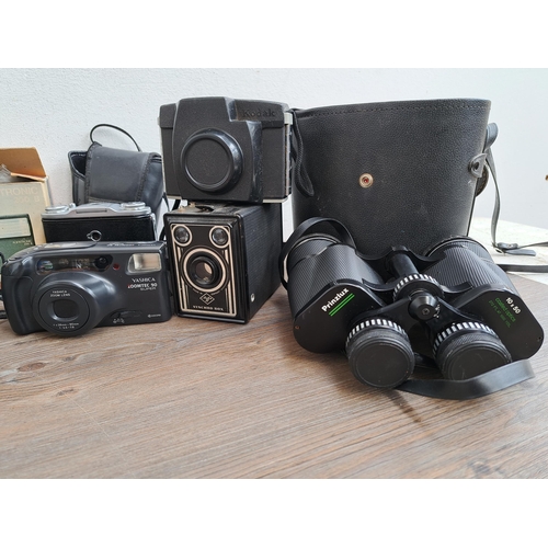 562 - A large collection of cameras, optical instruments and accessories to include Fujica MP 35mm rangefi... 