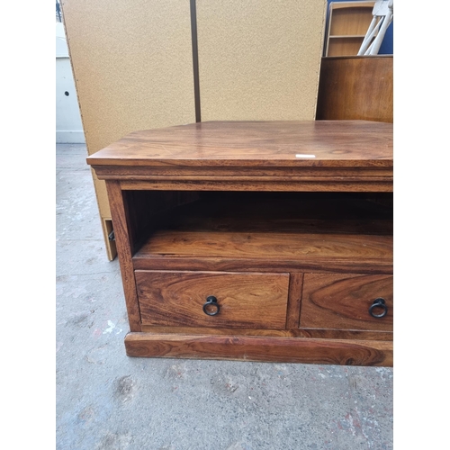 102 - An Indian sheesham wood two drawer TV stand